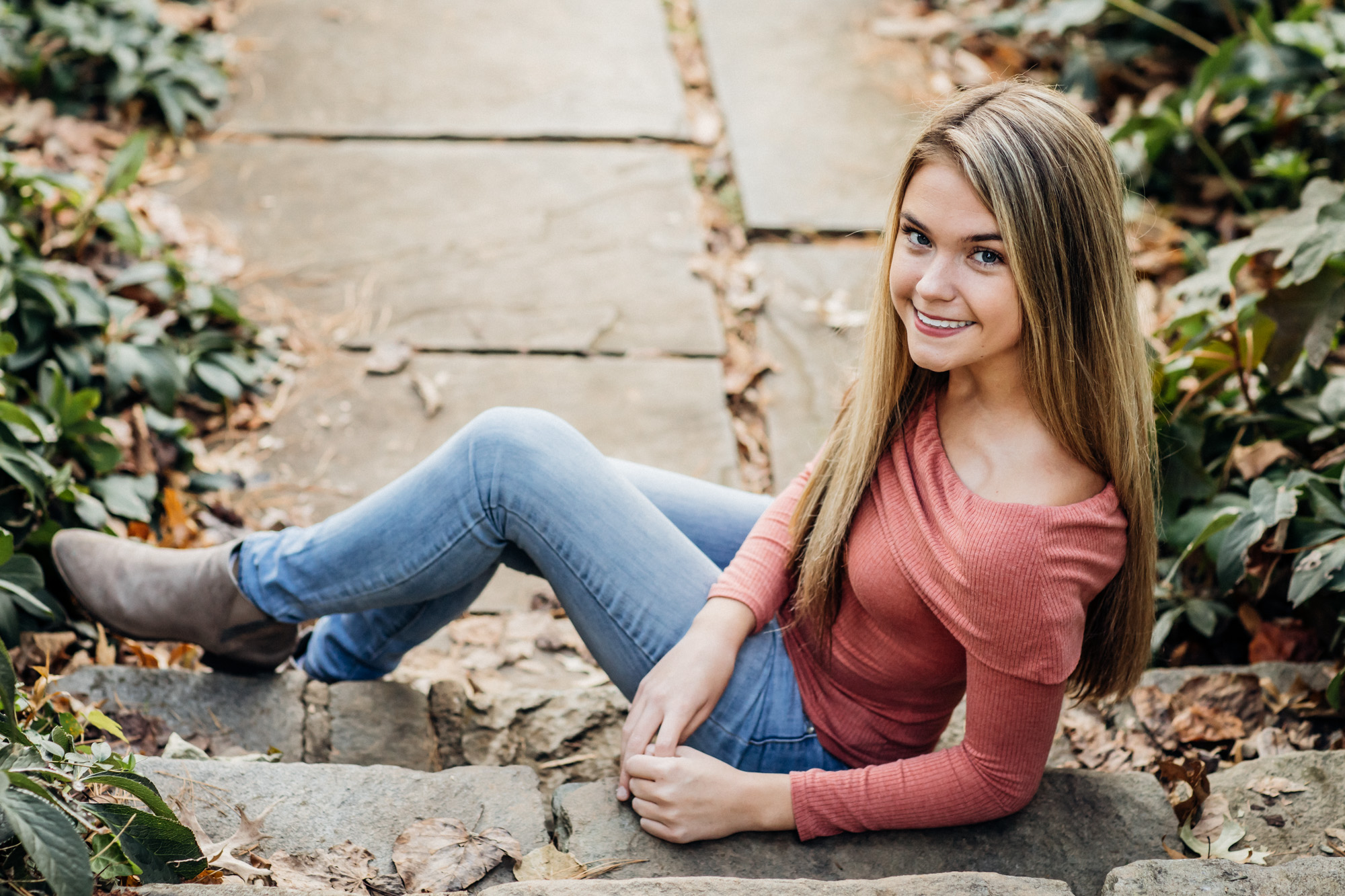 High School Senior girl sitting on steps for senior portraits