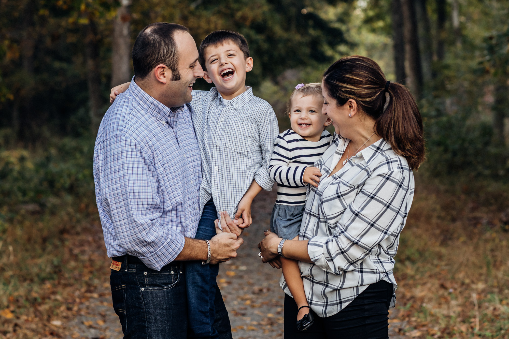 Family laughing for their family photos